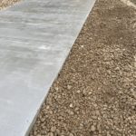 Underground Bunker Concrete Pad With 4" French Drain 2" Minus Rock